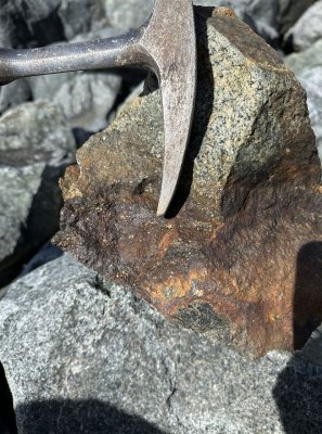 Iron-stained rock sample with sulphides at Saint John